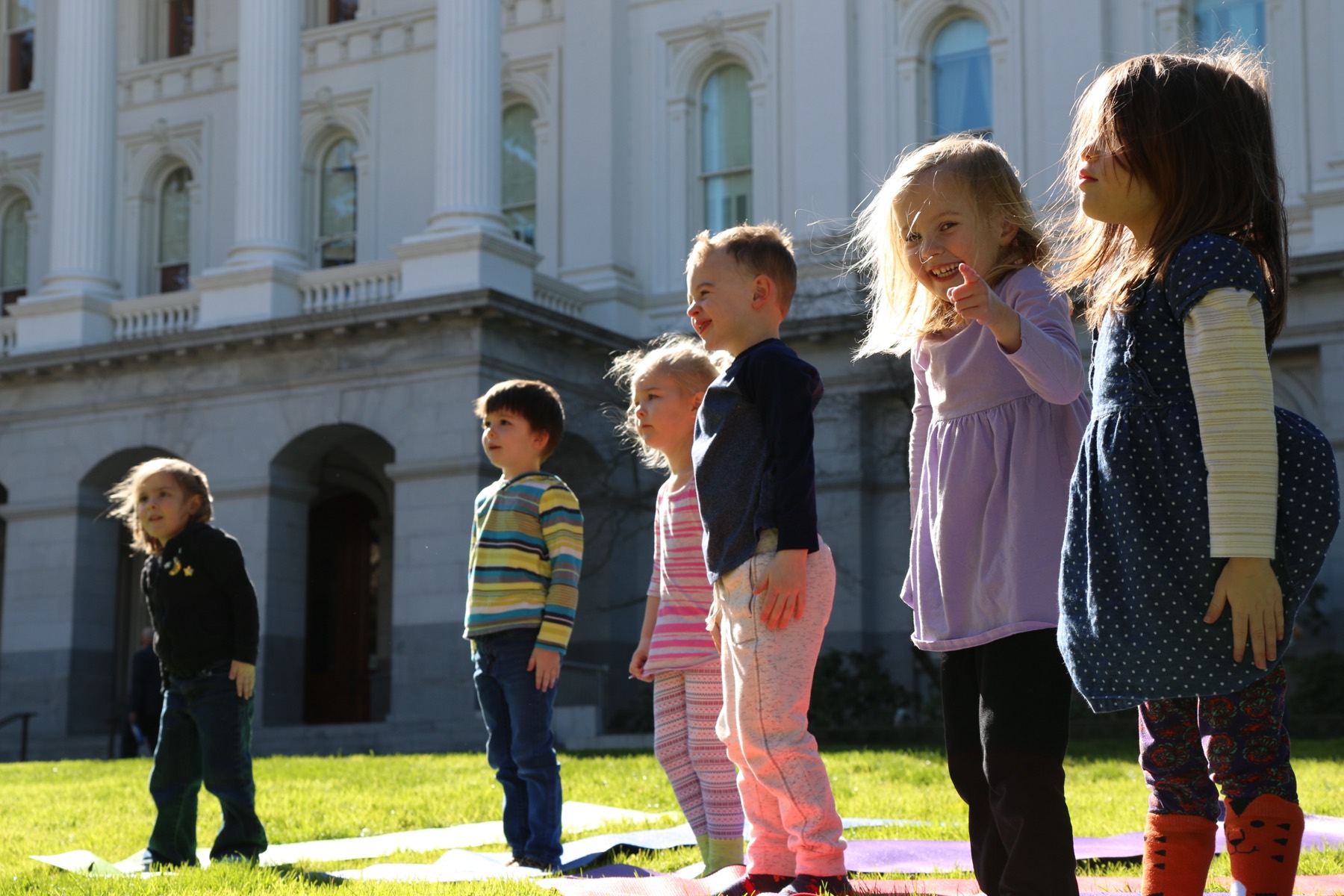 Children gathered together in a community moment at Growing Mindfully Sacramento.