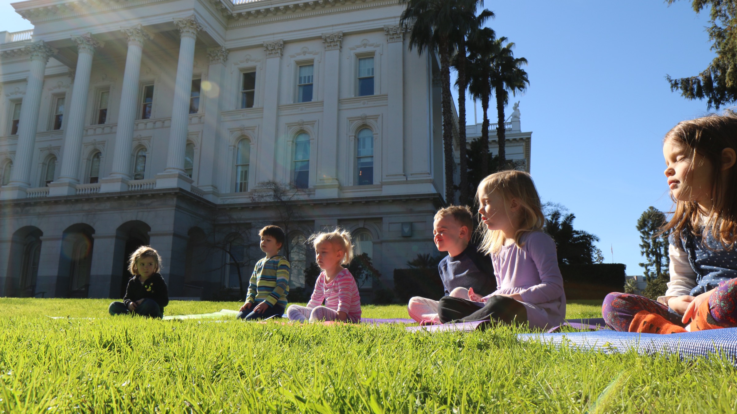Children in calm seated practice during infant program at Growing Mindfully Sacramento.